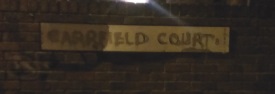 Graffiti on sign to Carrfield Court